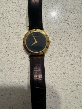 Gucci Black Dial Gold-Tone Bezel Leather Strap Watch